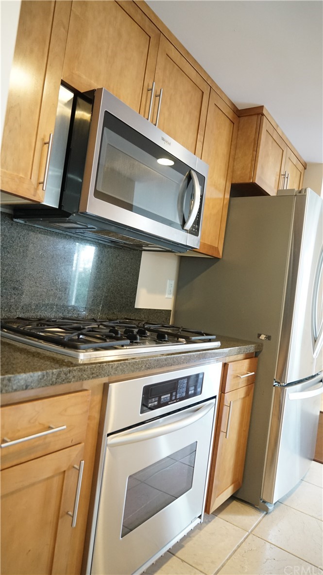 400 West Ocean Boulevard, Unit 206 Long Beach, CA 90802 - Photo 11 of 20 a stove top oven sitting inside of a kitchen