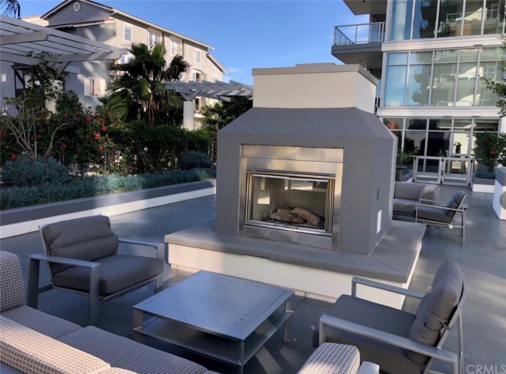 400 West Ocean Boulevard, Unit 206 Long Beach, CA 90802 - Photo 17 of 20 a view of a patio with couches table and chairs and potted plants