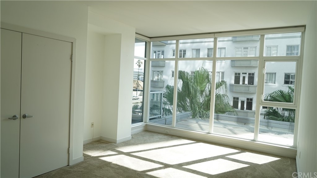 400 West Ocean Boulevard, Unit 206 Long Beach, CA 90802 - Photo 6 of 20 a view of a glass door with a glass door
