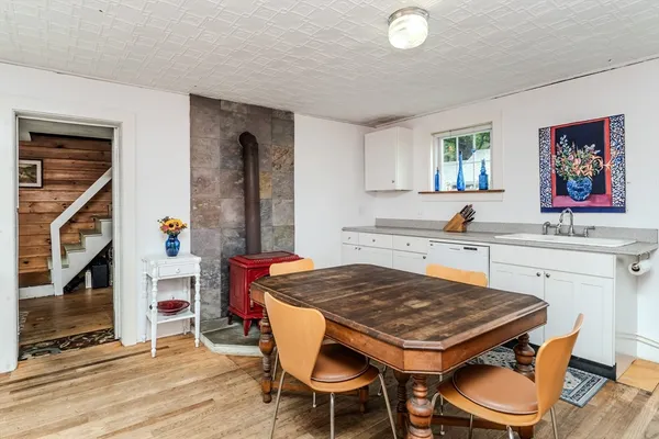 a dining room with a table and chairs