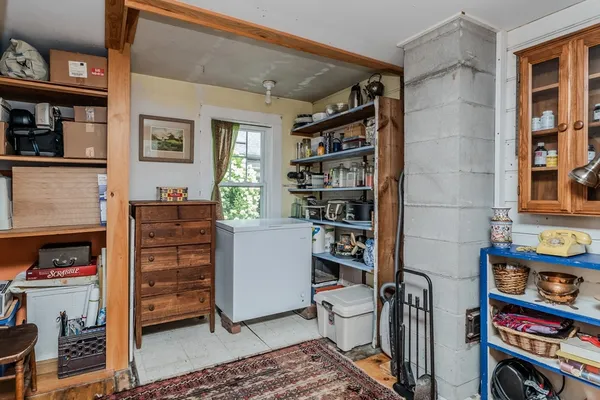a view of walk in closet and bedroom