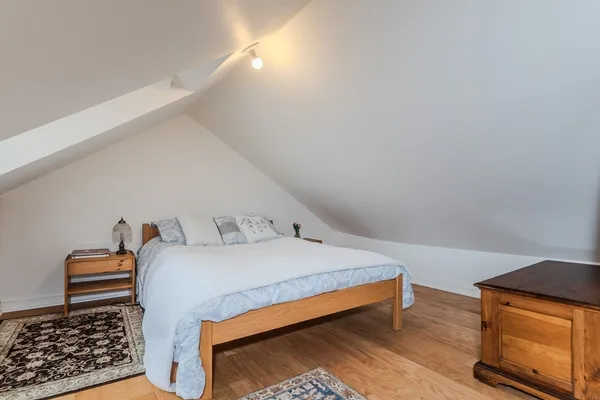 a bedroom with furniture and window