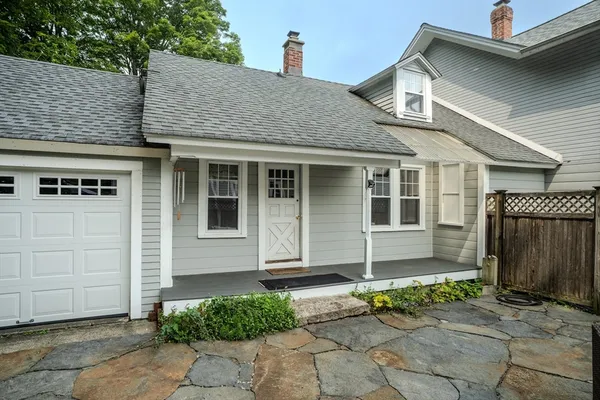 a view of a patio with furniture and a backyard