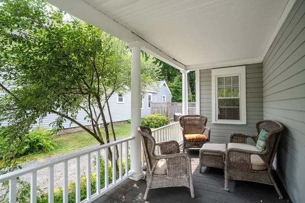 a view of a chair and table in the balcony