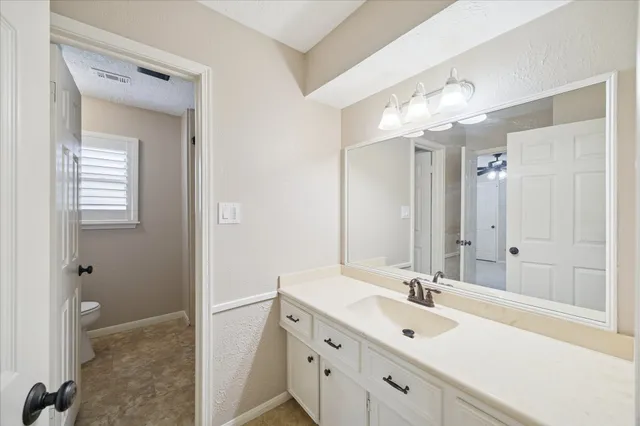 a bathroom with a sink double vanity and a mirror