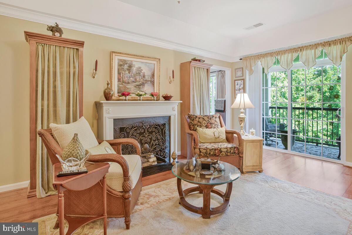 7315 Maplecrest Road, Unit 405 Elkridge, MD 21075 - Photo 15 of 76 a living room with furniture and a fireplace