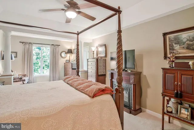 a bathroom with a granite countertop toilet sink and mirror