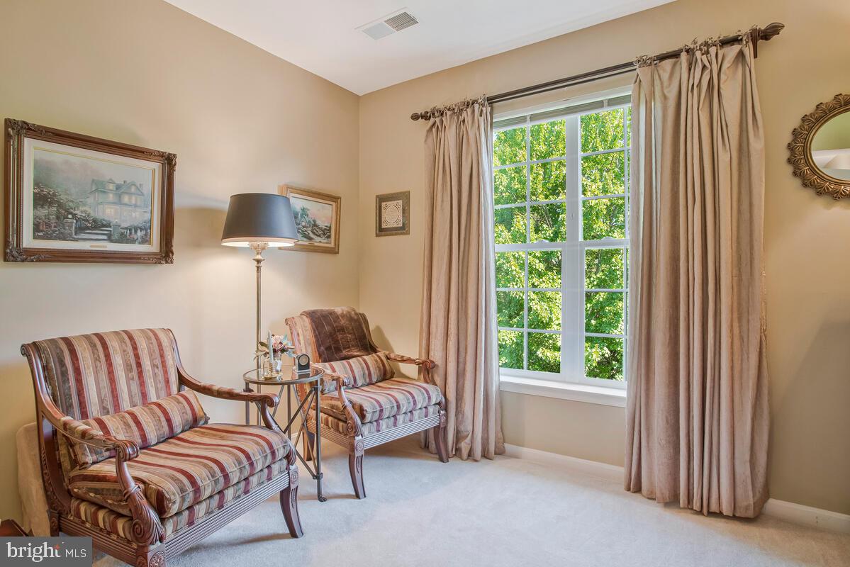 7315 Maplecrest Road, Unit 405 Elkridge, MD 21075 - Photo 24 of 76 a living room with furniture and a window