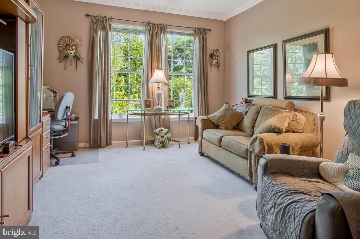 7315 Maplecrest Road, Unit 405 Elkridge, MD 21075 - Photo 27 of 76 a living room with furniture and a large window
