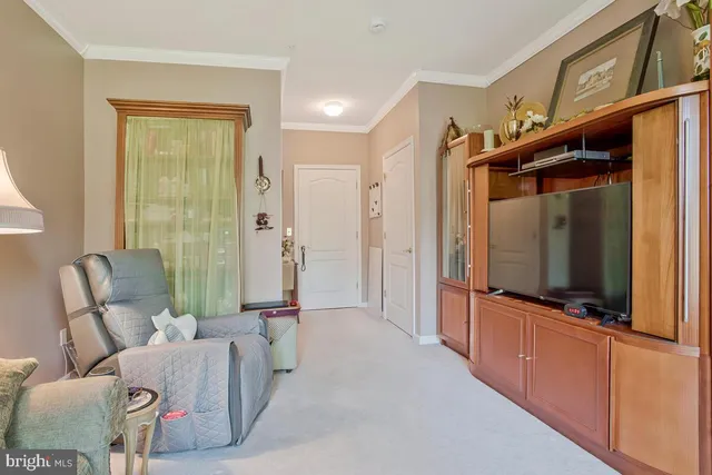 a view of a building with cars parked on the roadside