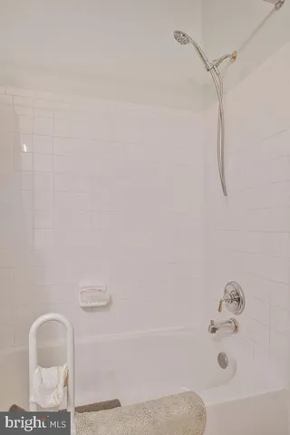 a view of a garden with plants and outdoor seating