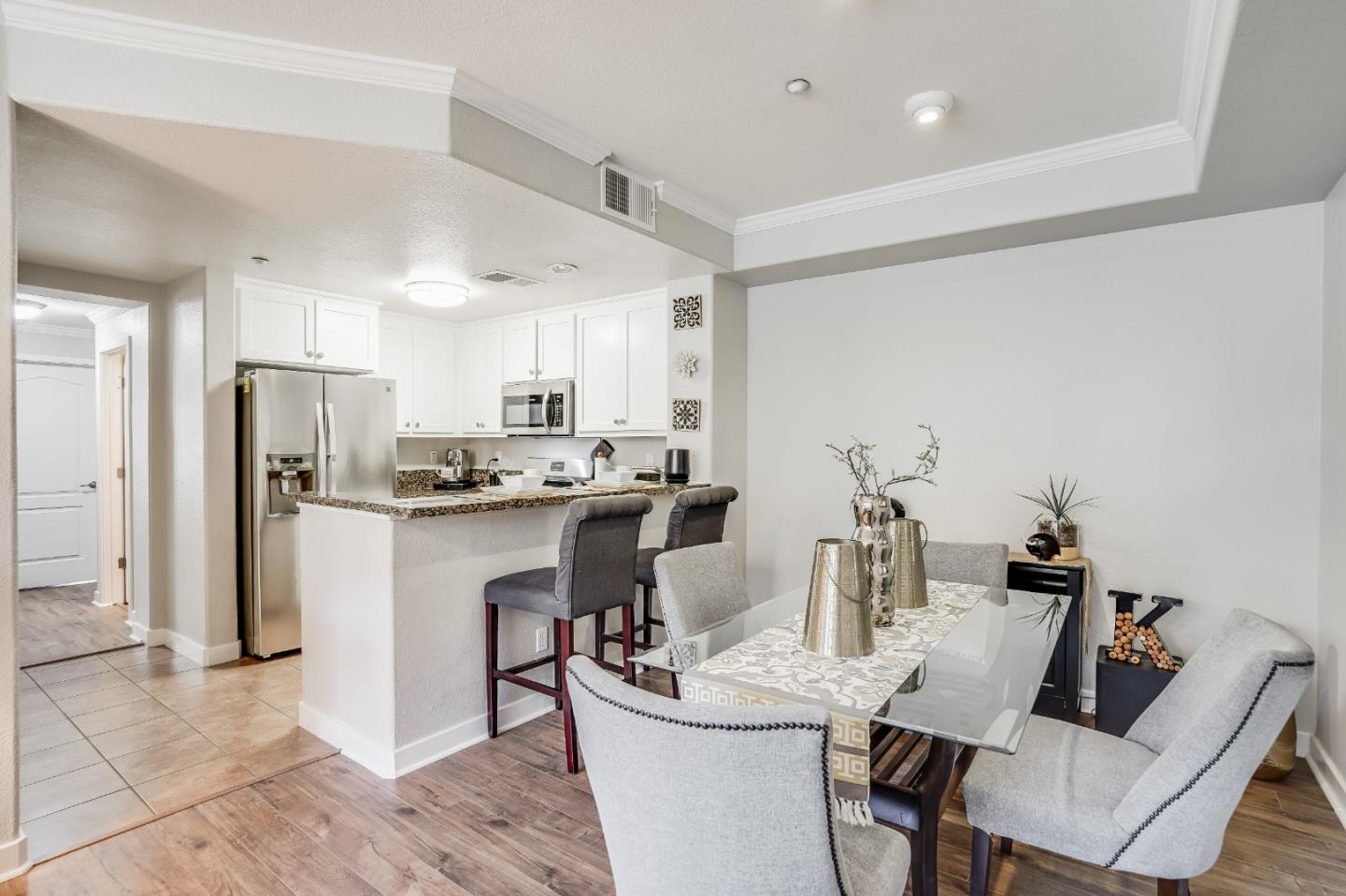 6132 Old Quarry Loop Oakland, CA 94605 - Photo 1 of 38 a kitchen with refrigerator and chairs
