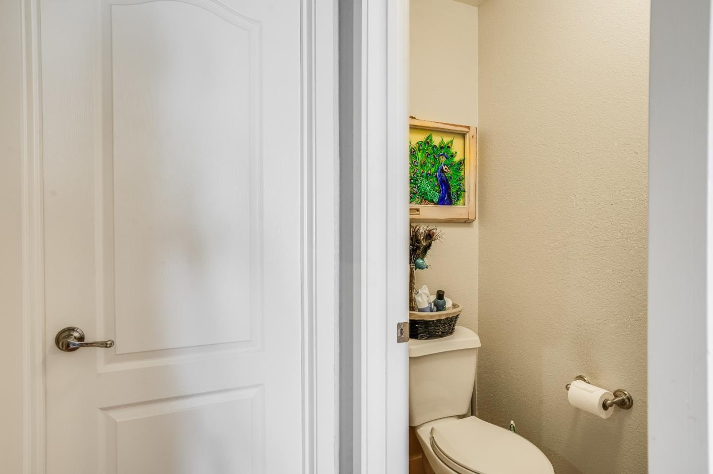 6132 Old Quarry Loop Oakland, CA 94605 - Photo 14 of 38 a white toilet sitting next to a bathroom sink