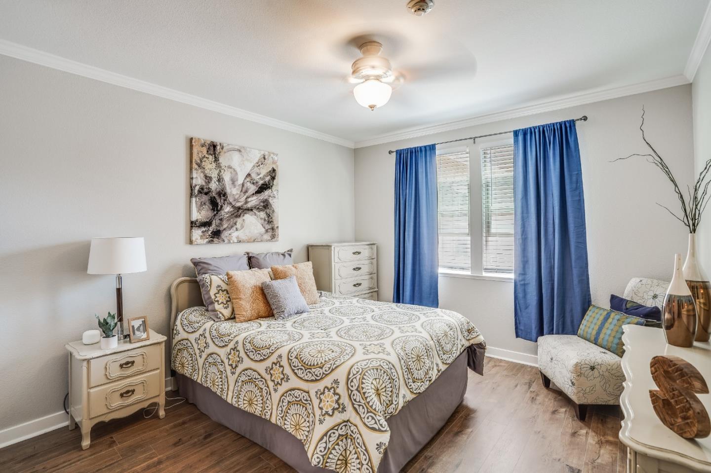 6132 Old Quarry Loop Oakland, CA 94605 - Photo 9 of 38 a bedroom with a bed and wooden floor