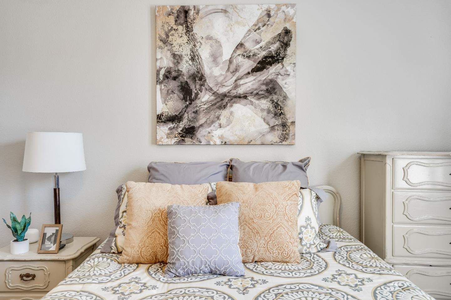 6132 Old Quarry Loop Oakland, CA 94605 - Photo 10 of 38 a bedroom with a bed and a lamp