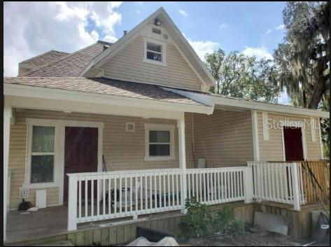 a porch with a wooden fence