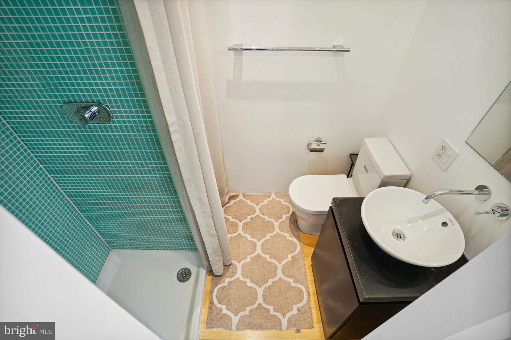 978 Florida Avenue Northwest Washington, DC 20001 - Photo 12 of 39 a bathroom with a sink and mirror