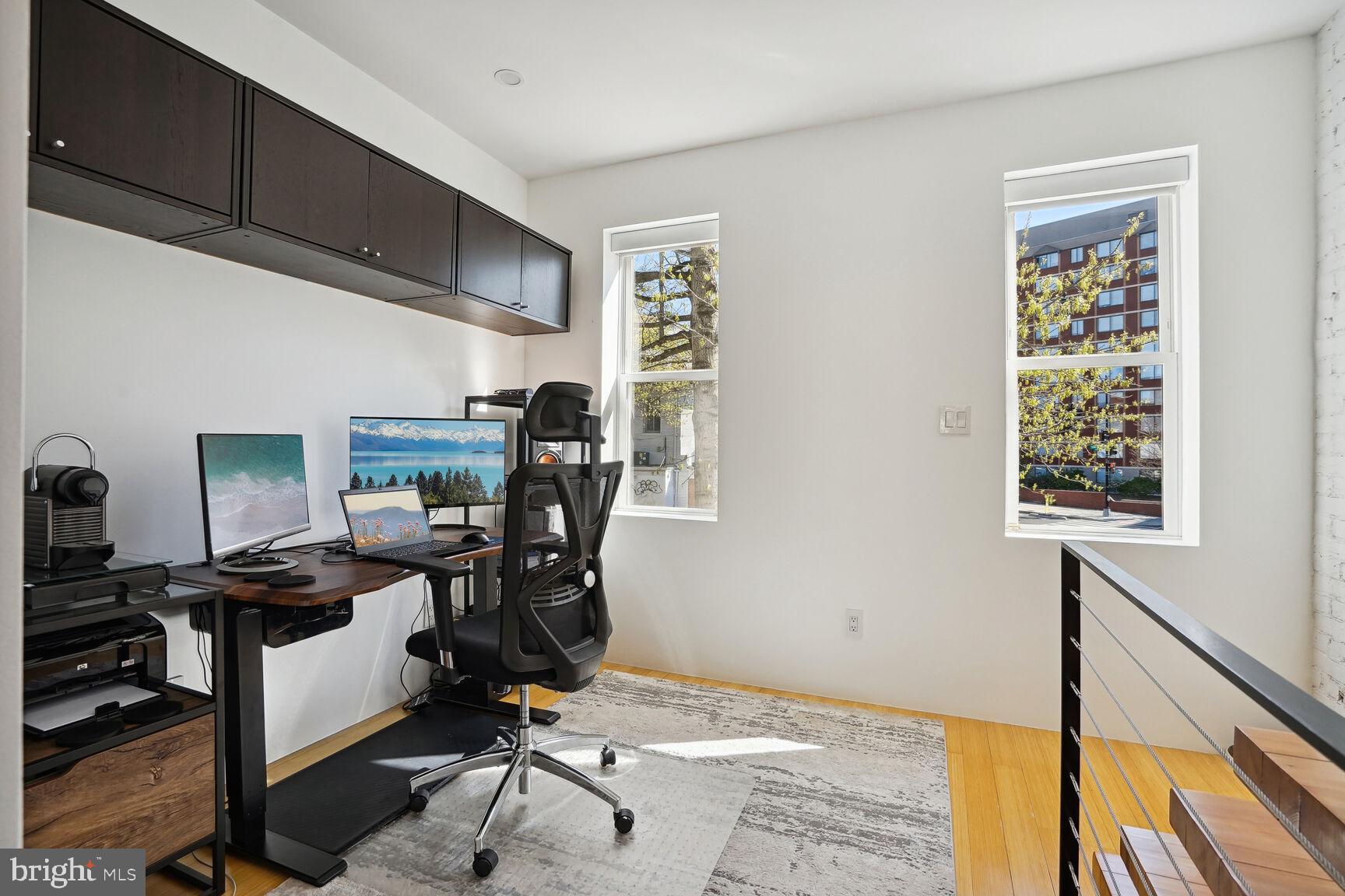 978 Florida Avenue Northwest Washington, DC 20001 - Photo 13 of 39 a view of a workspace with furniture and a window