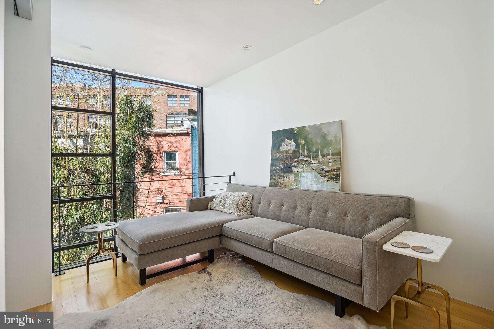 978 Florida Avenue Northwest Washington, DC 20001 - Photo 14 of 39 a living room with furniture and a window