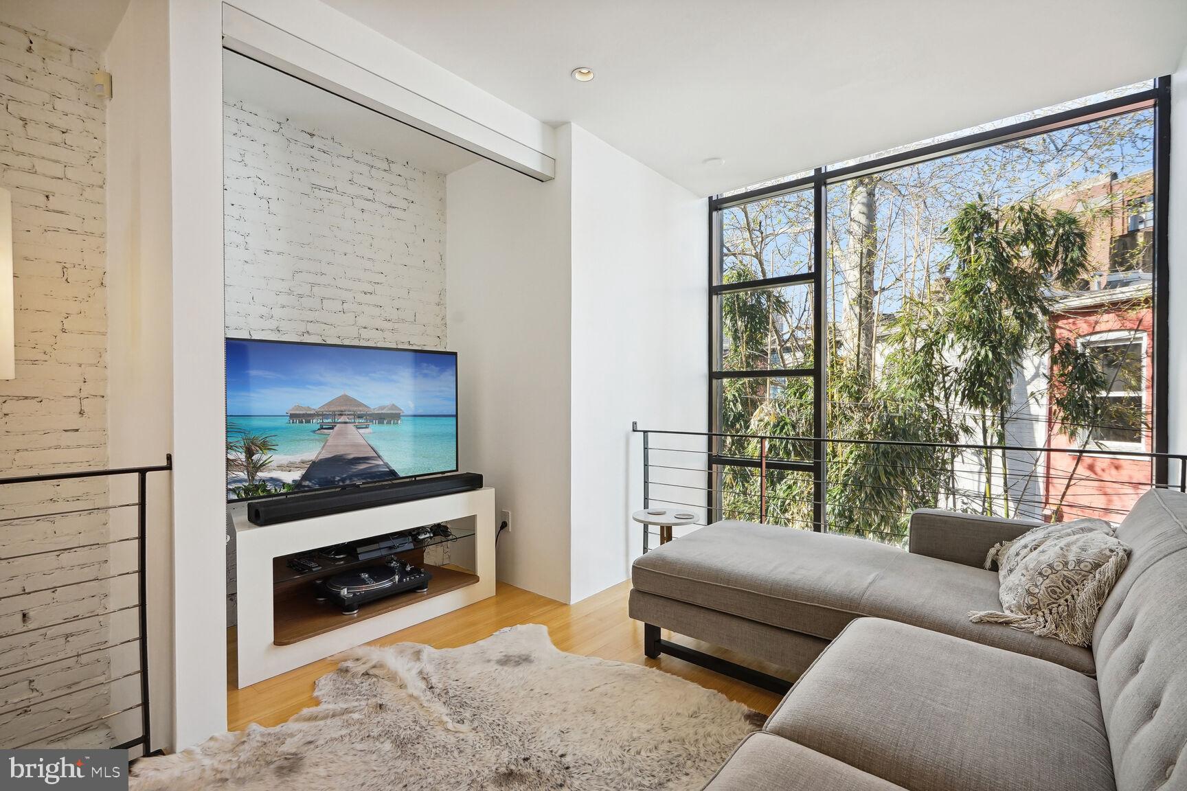 978 Florida Avenue Northwest Washington, DC 20001 - Photo 17 of 39 a living room with furniture and a fireplace
