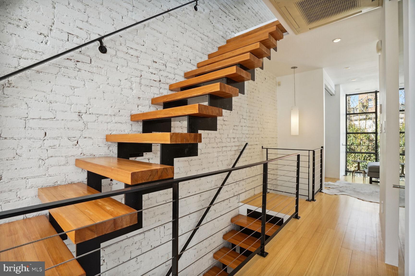 978 Florida Avenue Northwest Washington, DC 20001 - Photo 19 of 39 a view of entryway with wooden floor and stairs