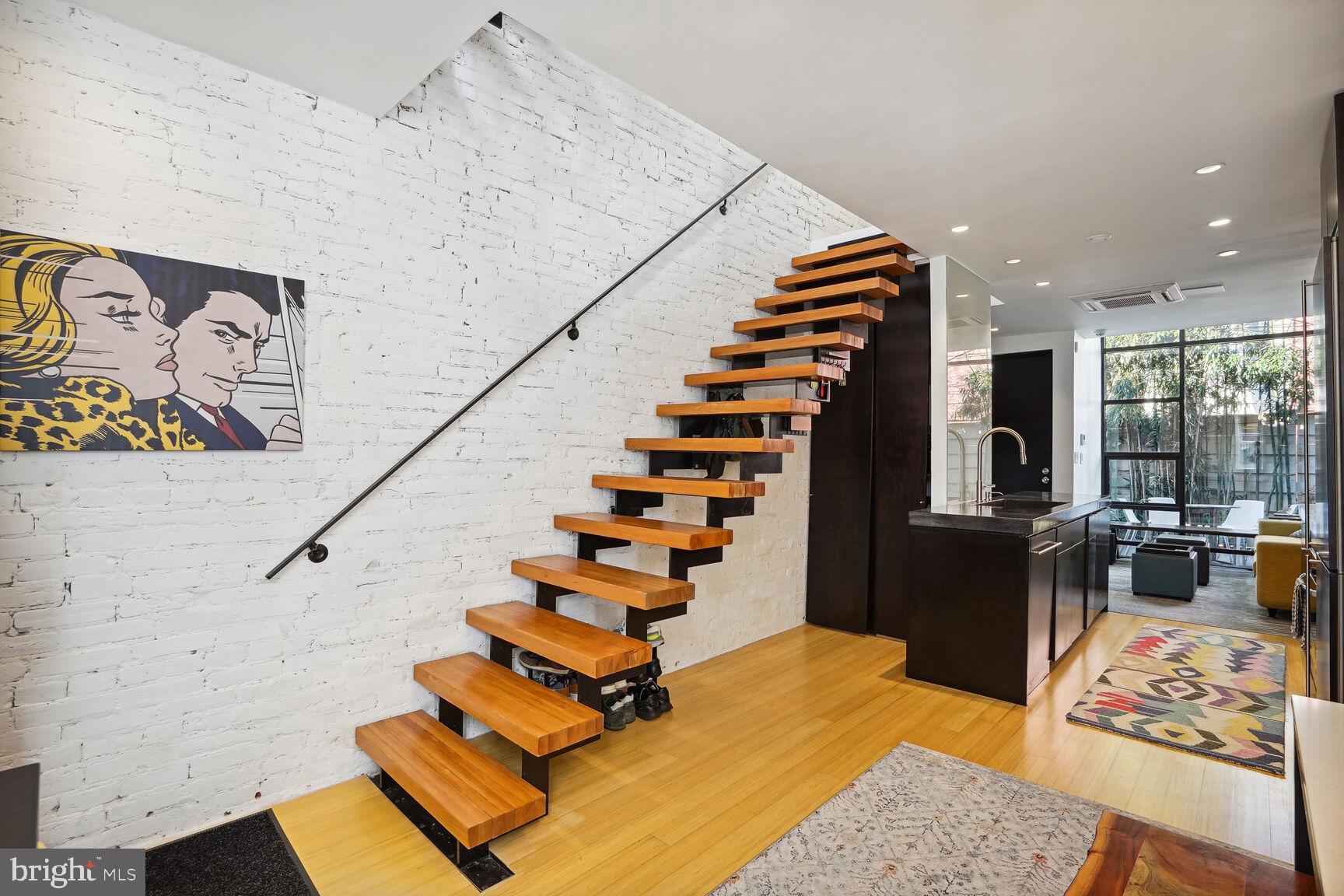 978 Florida Avenue Northwest Washington, DC 20001 - Photo 5 of 39 a view of entryway with stairs and wooden floor
