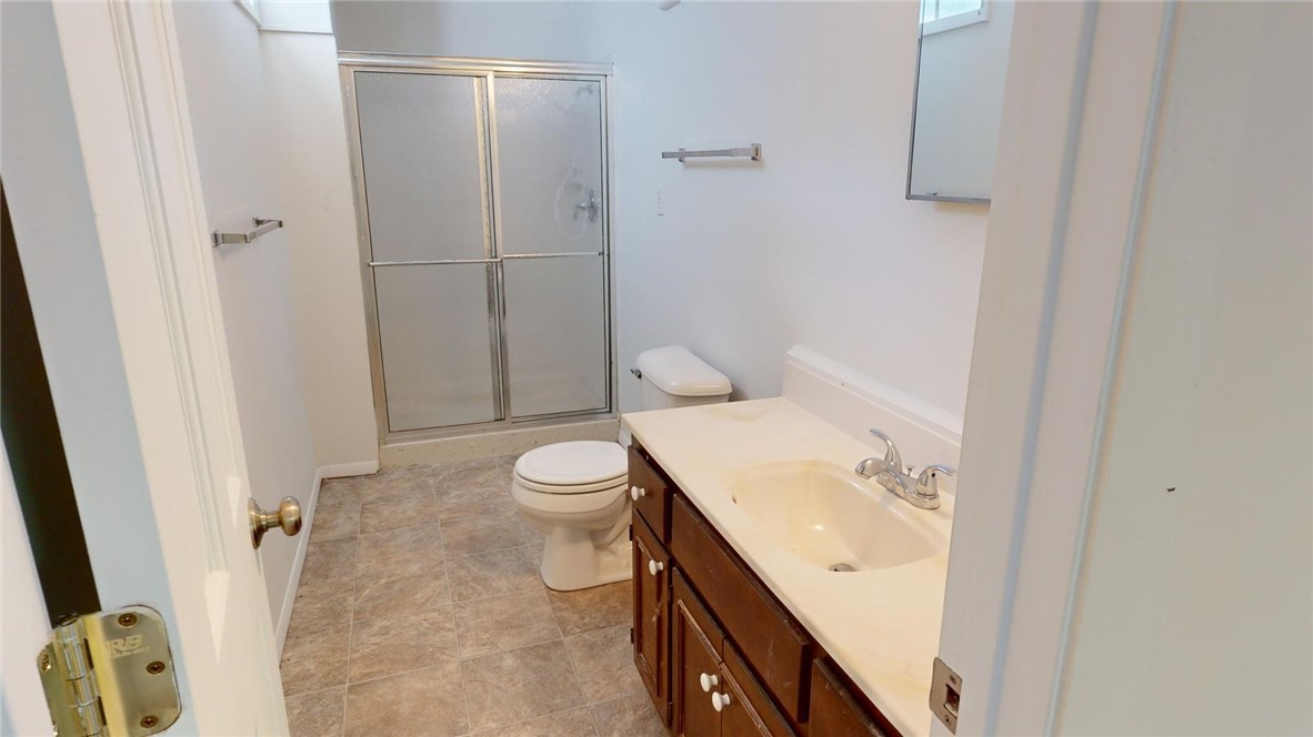 396 West Ash Avenue Decatur, IL 62526 - Photo 27 of 37 a bathroom with a sink a toilet and shower