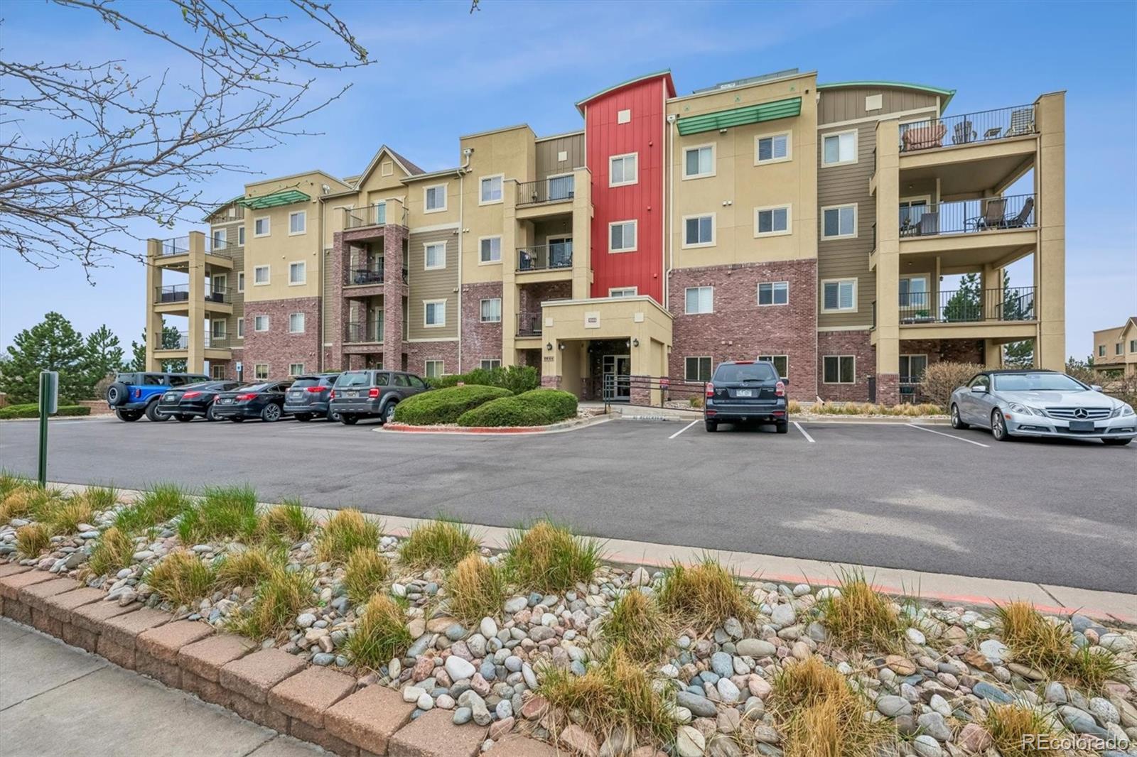1044 Rockhurst Drive, Unit 404 Highlands Ranch, CO 80129 - Photo 8 of 28 a front view of a building with street view