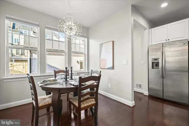 a view of a dining room with furniture and window