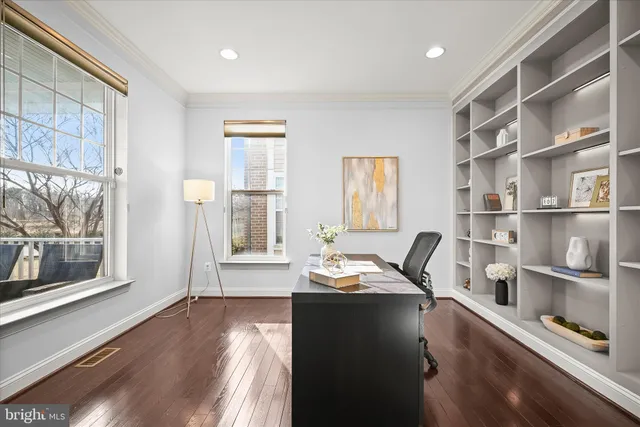 a view of a livingroom with furniture and a large window