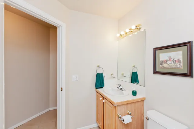 a room with a table and a painting