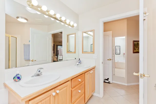 a bathroom with a sink a vanity and a mirror