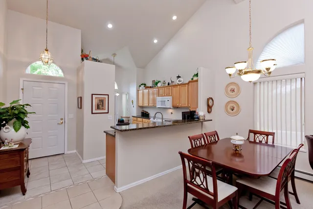a kitchen with a table and chairs in it