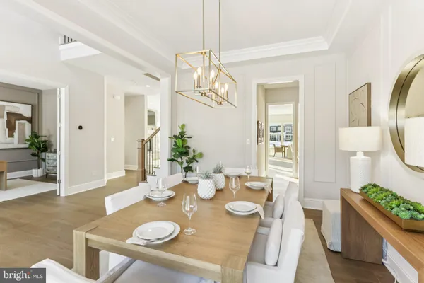 a kitchen with stainless steel appliances granite countertop a stove a sink a kitchen island with chairs and cabinets