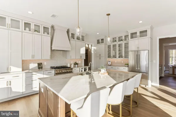 a kitchen with granite countertop a sink and cabinets