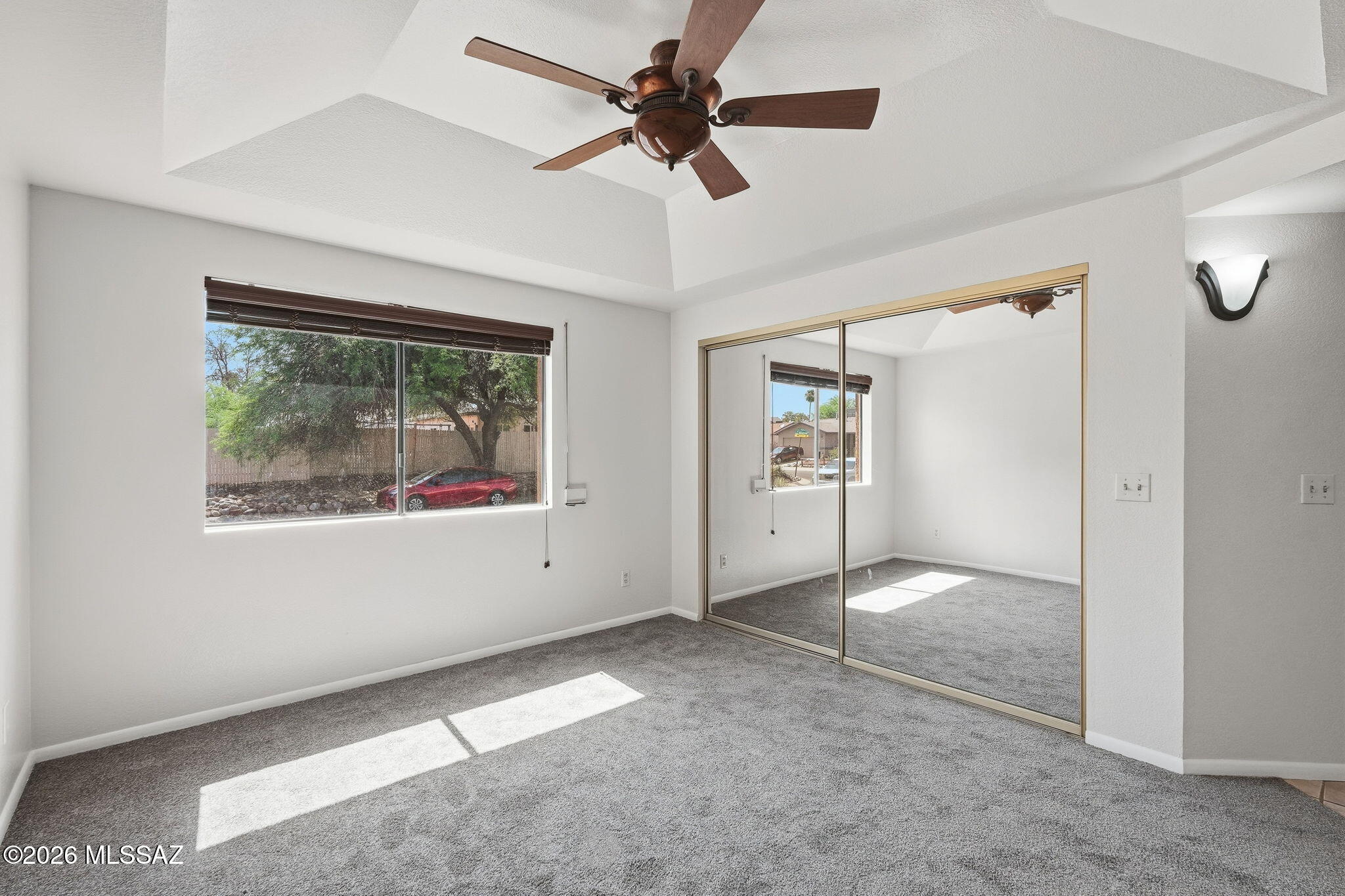 5791 North Moonbrook Road Tucson, AZ 85741 - Photo 18 of 40 Primary Bedroom with Wood Blinds and Outside Rolling Shutters