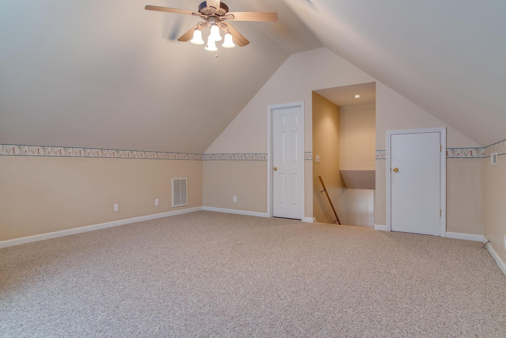 169 Foxrun Springfield, TN 37172 - Photo 21 of 24 a view of an empty room with a chandelier fan
