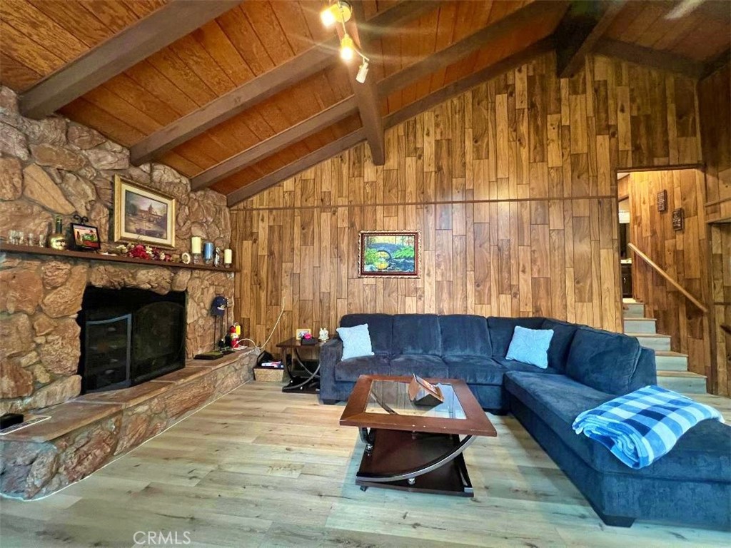1198 Arbula Drive Crestline, CA 92325 - Photo 14 of 27 a living room with furniture and a fireplace