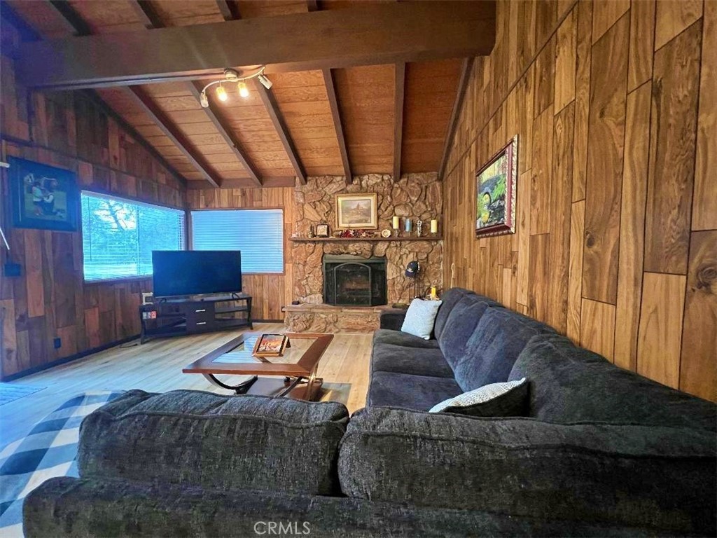 1198 Arbula Drive Crestline, CA 92325 - Photo 15 of 27 a living room with furniture and a fireplace