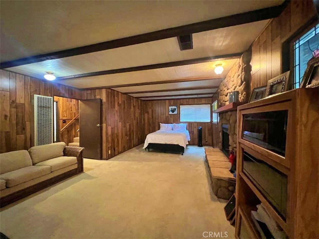 1198 Arbula Drive Crestline, CA 92325 - Photo 17 of 27 a bedroom with a bed a couch and dresser