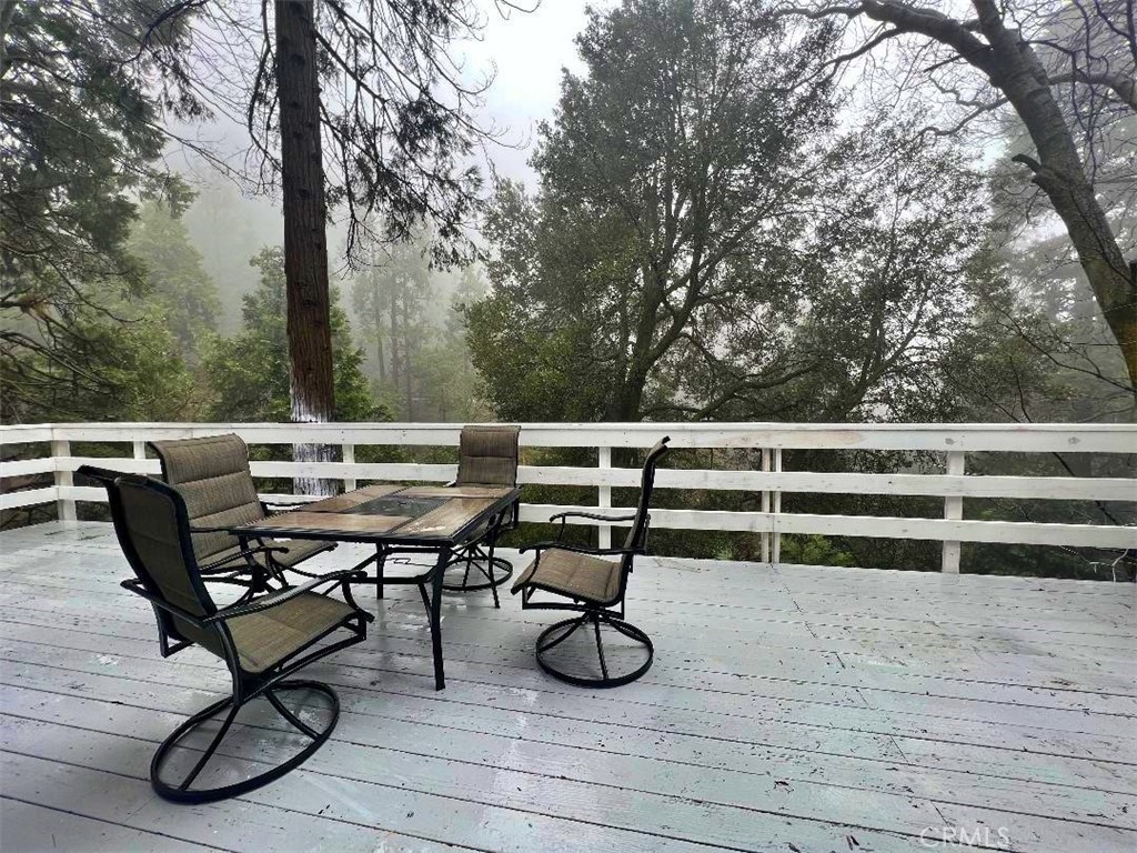1198 Arbula Drive Crestline, CA 92325 - Photo 26 of 27 a view of a terrace with furniture and wooden floor