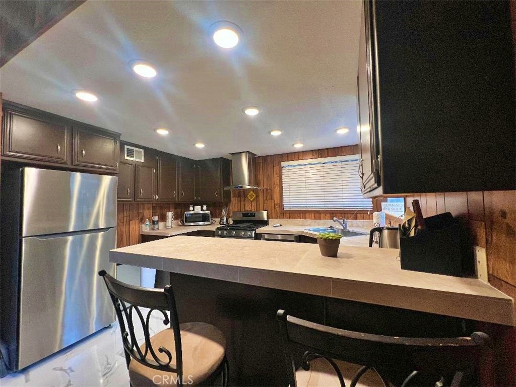 1198 Arbula Drive Crestline, CA 92325 - Photo 10 of 27 a kitchen with a sink cabinets and window
