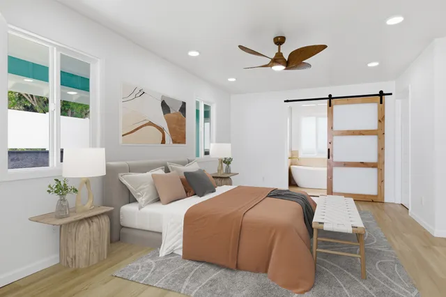 a bed room with bed and window