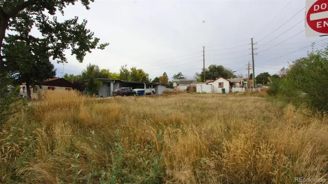 a view of a lake with boats and trees in the background