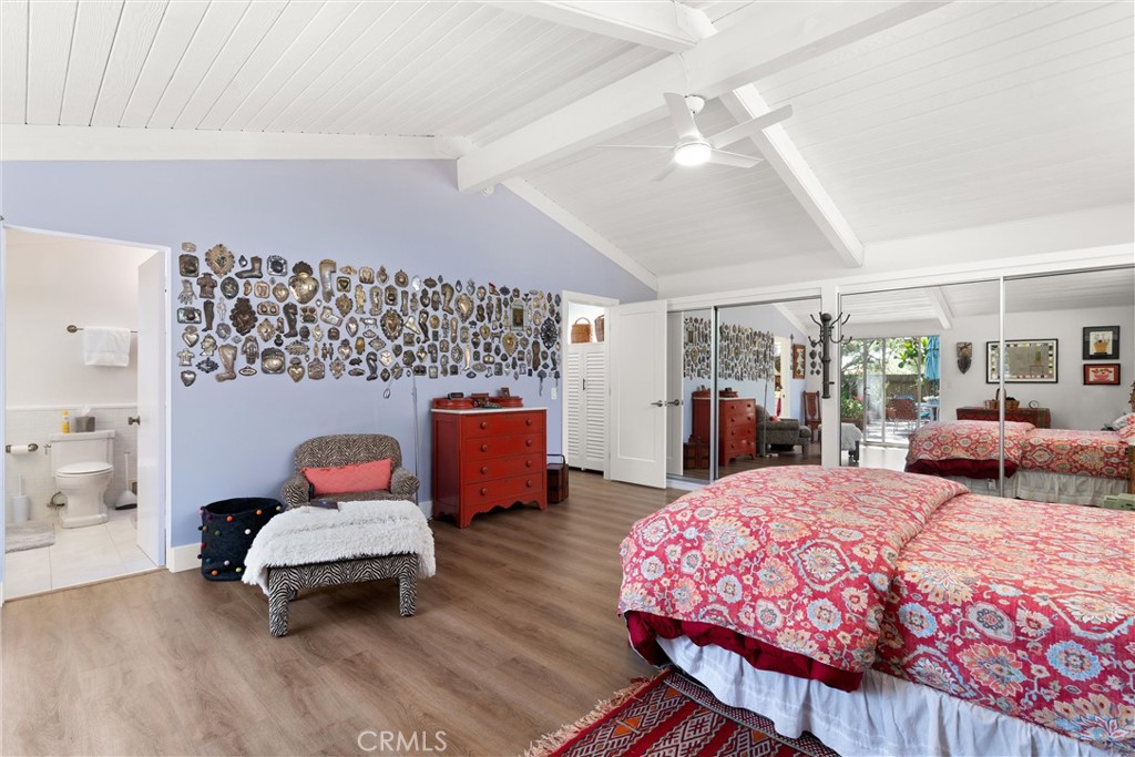 300 Emerald Bay Laguna Beach, CA 92651 - Photo 12 of 31 a bedroom with a bed and wooden floor