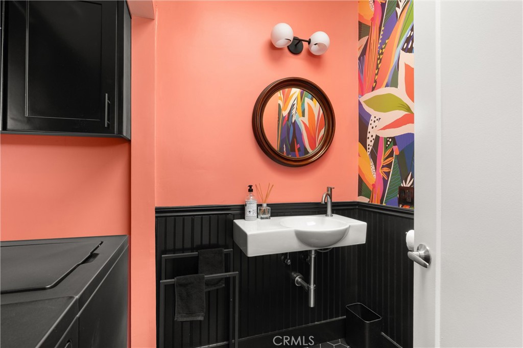 300 Emerald Bay Laguna Beach, CA 92651 - Photo 16 of 31 a bathroom with a sink and a mirror