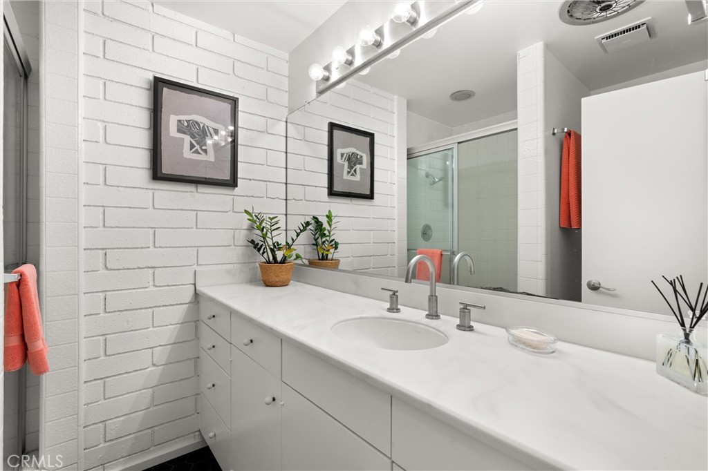 300 Emerald Bay Laguna Beach, CA 92651 - Photo 18 of 31 a bathroom with a sink and a mirror