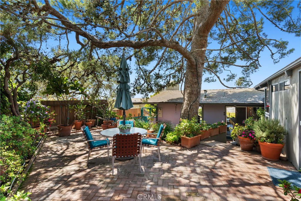300 Emerald Bay Laguna Beach, CA 92651 - Photo 21 of 31 a view of a house with sitting area and garden
