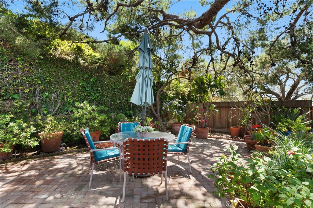 300 Emerald Bay Laguna Beach, CA 92651 - Photo 22 of 31 a view of backyard with outdoor seating and trees