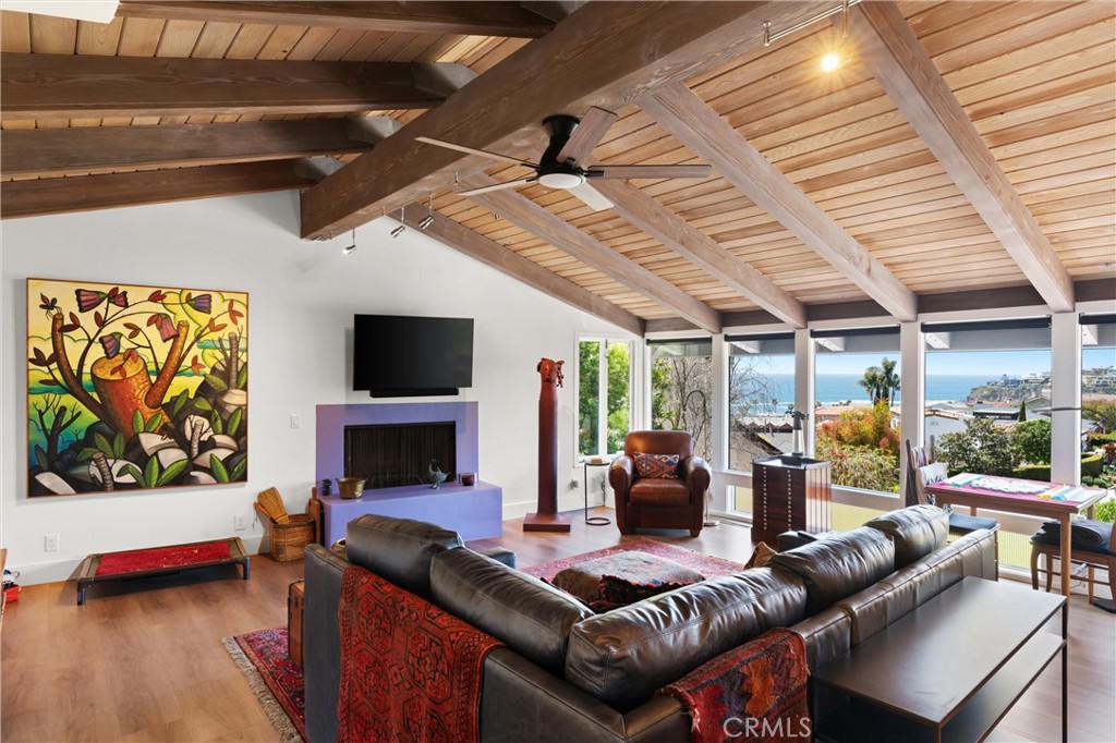 300 Emerald Bay Laguna Beach, CA 92651 - Photo 10 of 31 a living room with furniture a flat screen tv and a fireplace